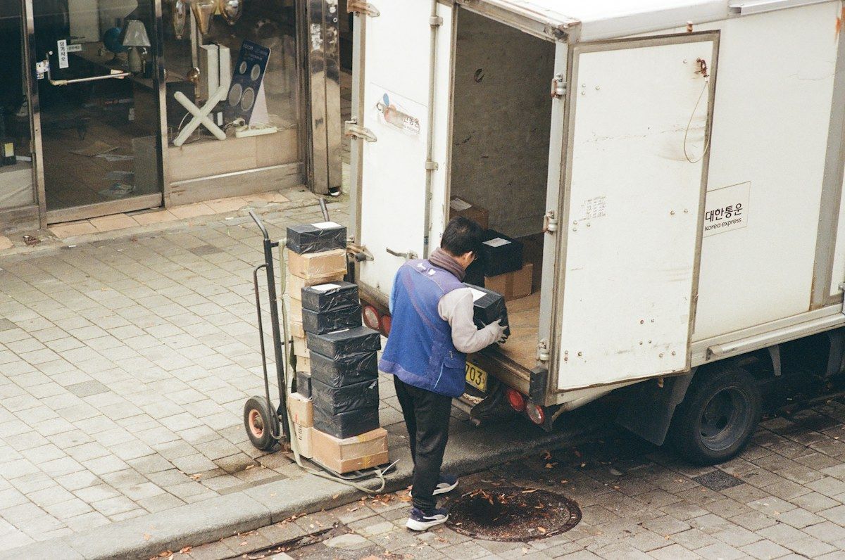 Boxes being loaded into the back of a box truck